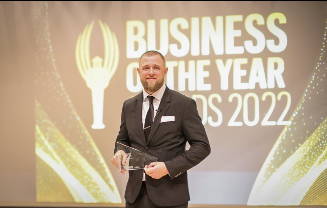Chris Jurgens receiving Veteran Owned Business of the Year from the Dayton Business Journal